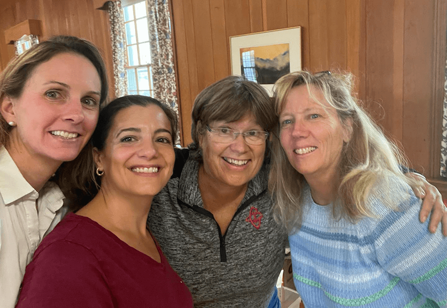 Left to Right Kelly Byrne Skarupa, Janelle Krizek, Beth Cliffand Patti Romaniello. Friends of the Library -- volunteers sorting books for the Annual Book Sale last fall.